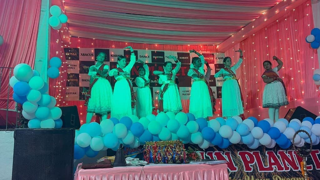 Classical dance group performing on stage at Funplanet Dhanbad