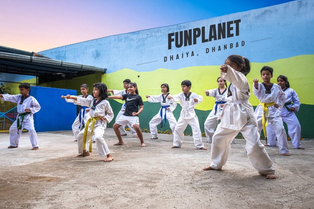 Children practicing Taekwondo at Funplanet activity center in Dhaiya, Dhanbad